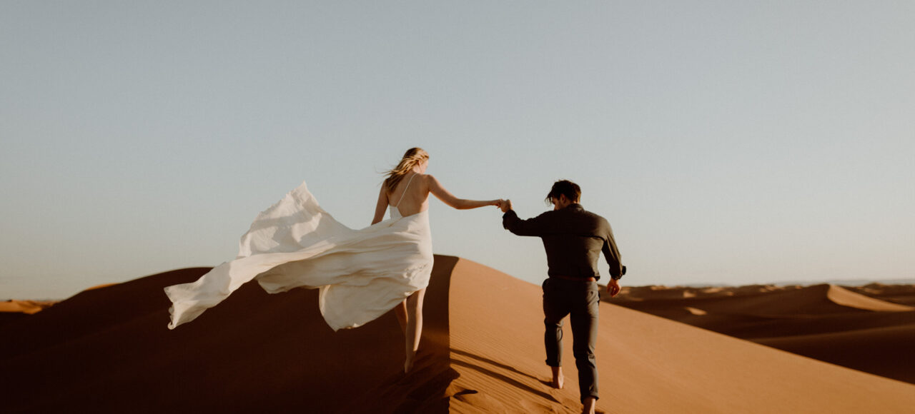 A couple enjoying the desert during their Morocco tour